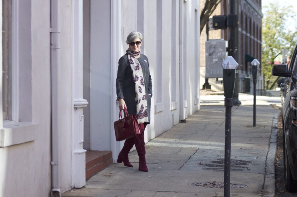 burgundy boots and statement handbag