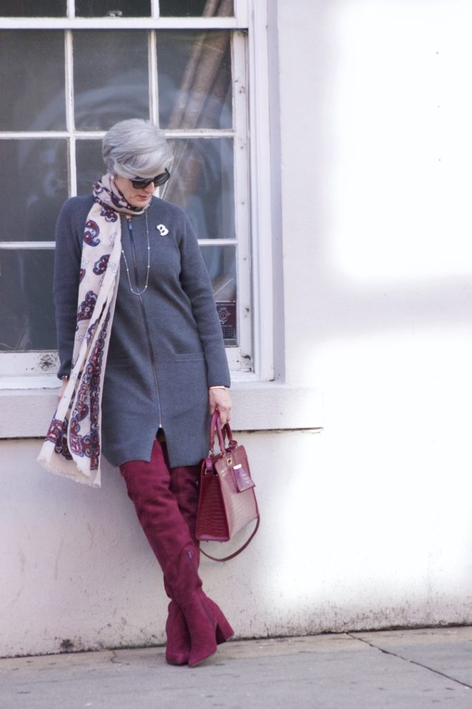 burgundy boots and statement handbag