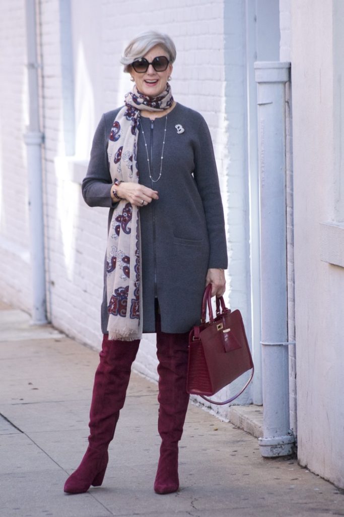 burgundy boots and statement handbag