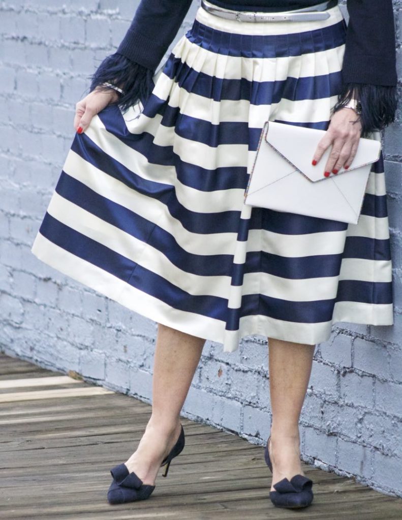 j.crew feather sleeve crewneck sweater, j.crew pleated satin stripe skirt, nine west suede pumps, rebecca minkoff leo envelope clutch