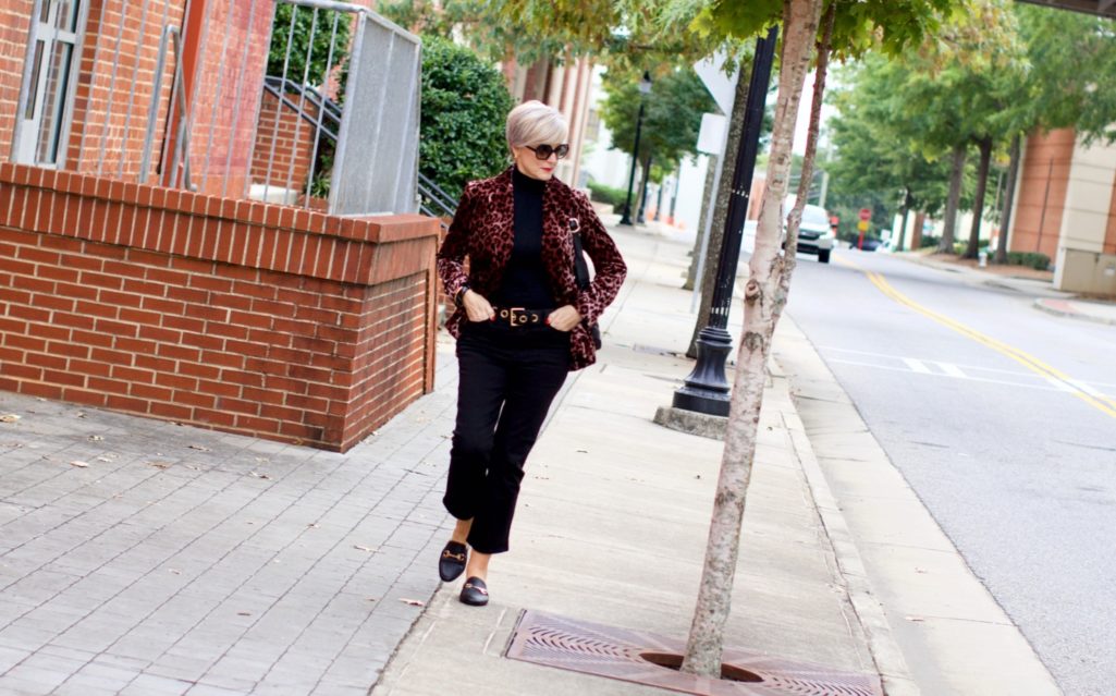 beth at Style at a Certain Age wears a J.Crew leopard blazer, cropped black jeans, Ralph Lauren turtleneck and Gucci dupes