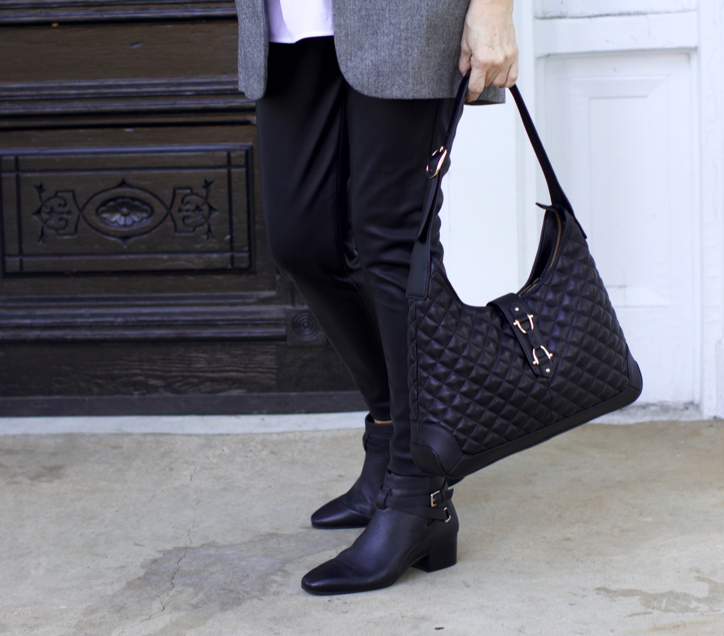 beth at Style at a Certain Age wears faux leather leggings, white shirt, boyfriend blazer, and black booties