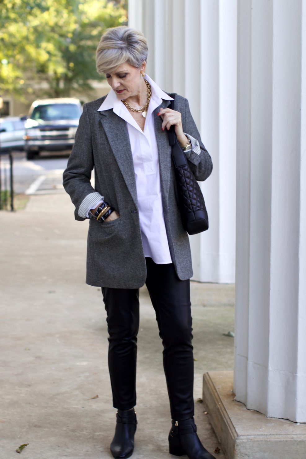 beth at Style at a Certain Age wears faux leather leggings, white shirt, boyfriend blazer, and black booties