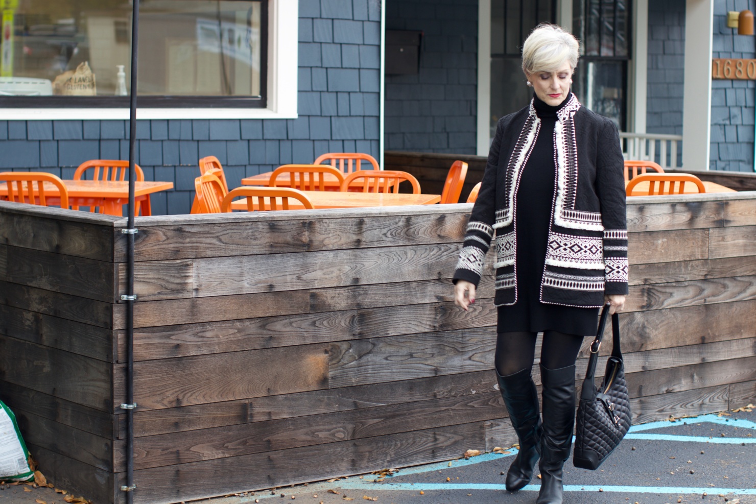 beth from style at a certain age wears a monochromatic outfit cashmere sweater dress from everlane, anthropologie embroidered jacket, black over the knee boots