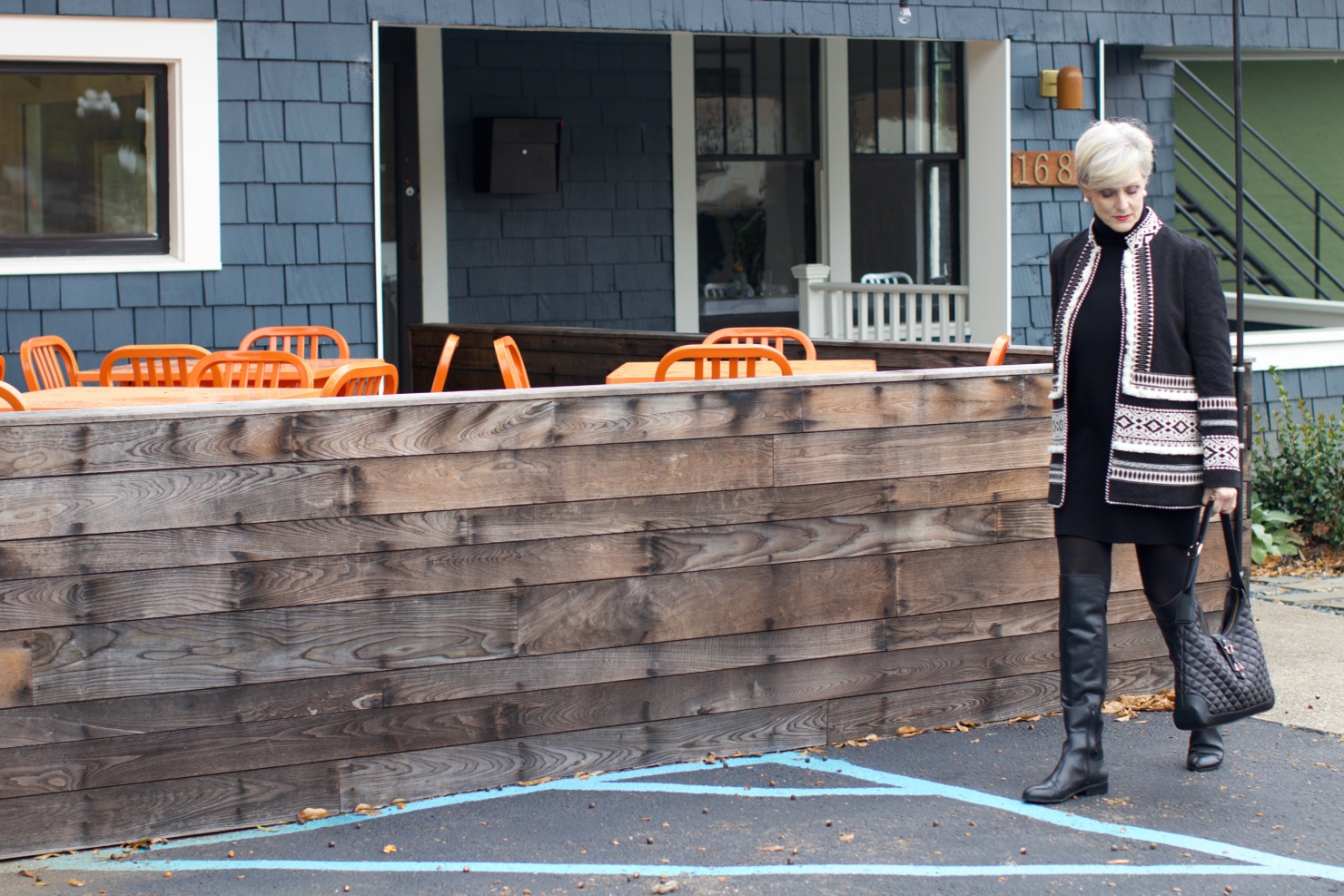 beth from style at a certain age wears a cashmere sweater dress from everlane, anthropologie embroidered jacket, black over the knee boots