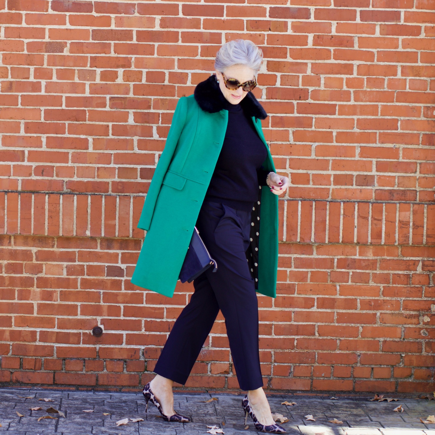 beth from Style at a Certain Age wears an Everlane cashmere turtleneck, Italian weave ankle pants, leopard pumps, and Talbots green overcoat