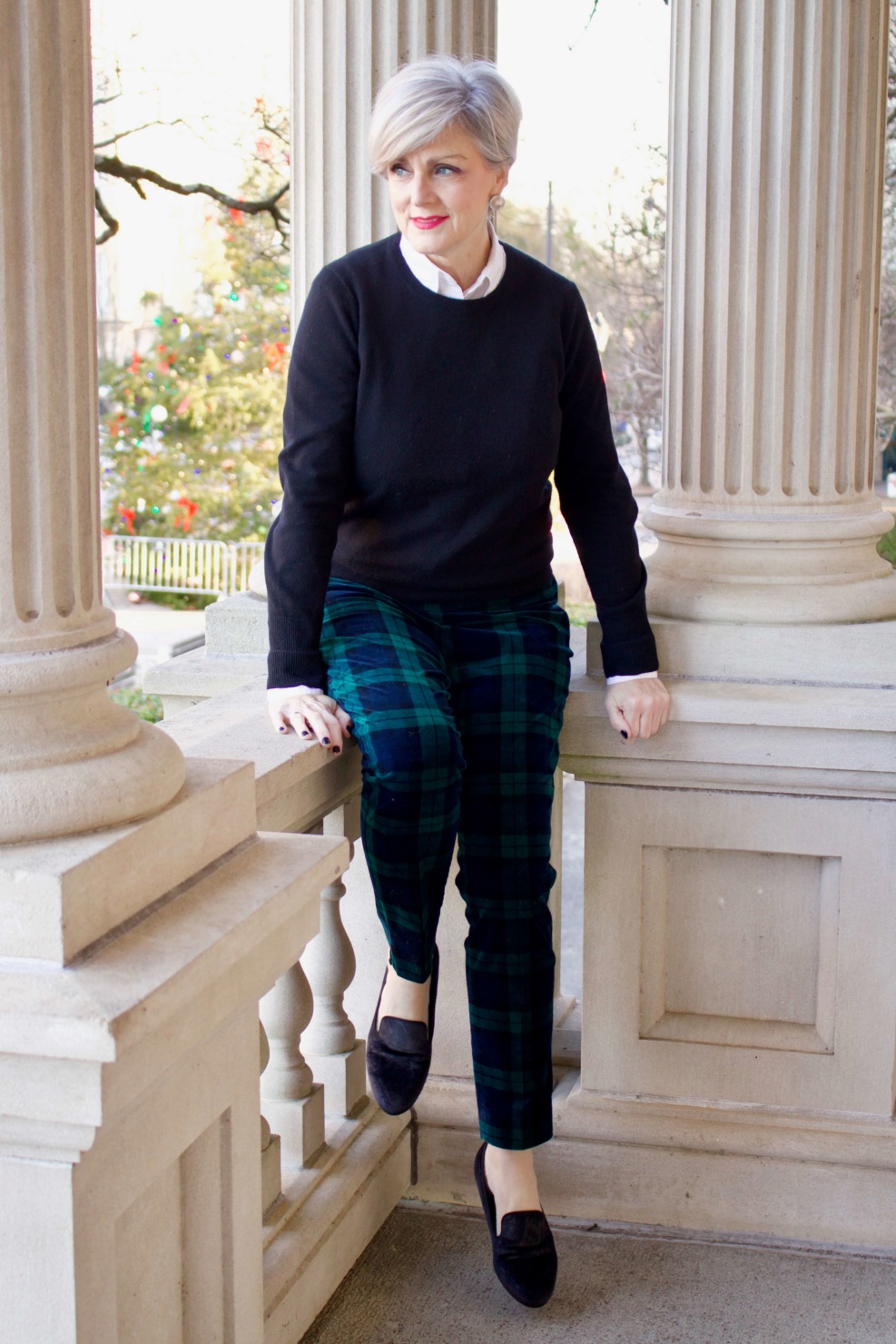 Christmas in the City - beth from Style at a Certain Age wears an Everlane black cashmere crewneck, Talbots black watch plaid ankle pants, and Talbots navy puffer jacket