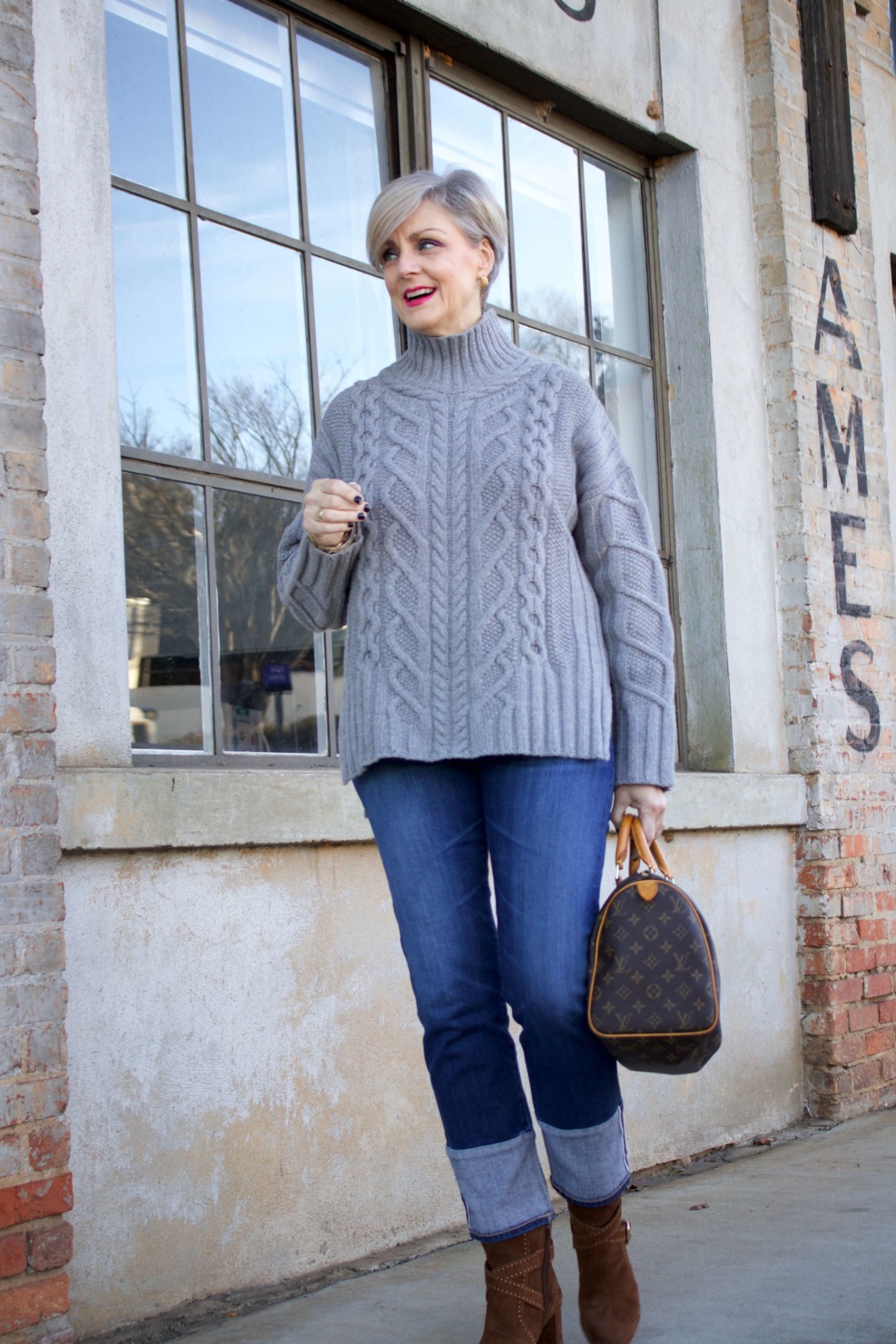 warm cozy sweater. beth from style at a certain age wears an Everlane cableknit sweater, AG denim, and suede boots from Ann Taylor