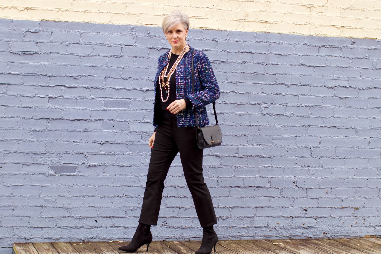 beth at Style at a Certain Age wears an Ann Taylor tweed military jacket, Everlane crewneck cashmere, J.Crew cropped flare denim, pointy-toed boots and strings of pearls