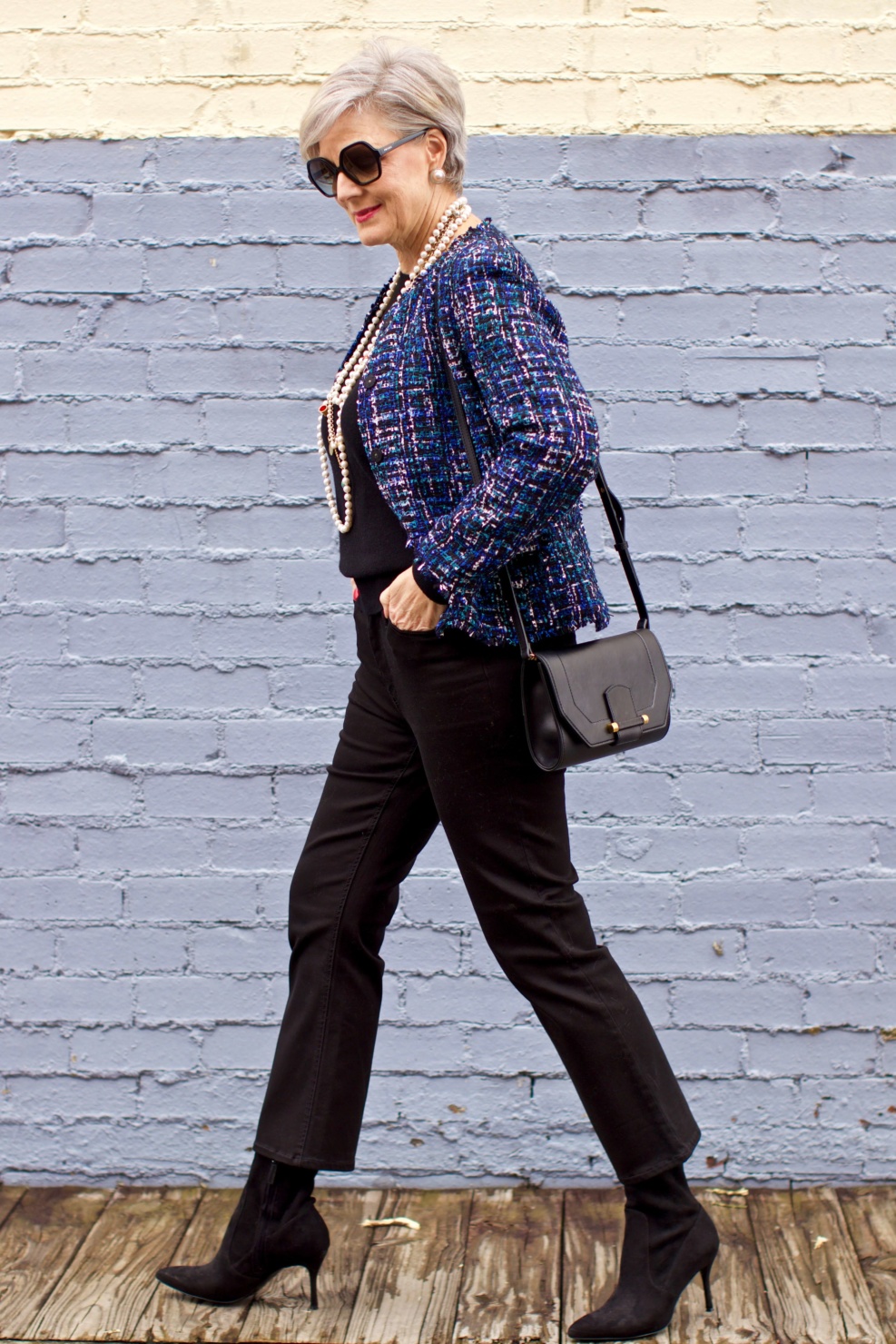 beth at Style at a Certain Age wears an Ann Taylor tweed military jacket, Everlane crewneck cashmere, J.Crew cropped flare denim, pointy-toed boots and strings of pearls