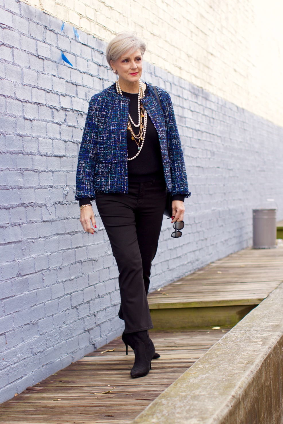 beth at Style at a Certain Age wears an Ann Taylor tweed military jacket, Everlane crewneck cashmere, J.Crew cropped flare denim, pointy-toed boots and strings of pearls