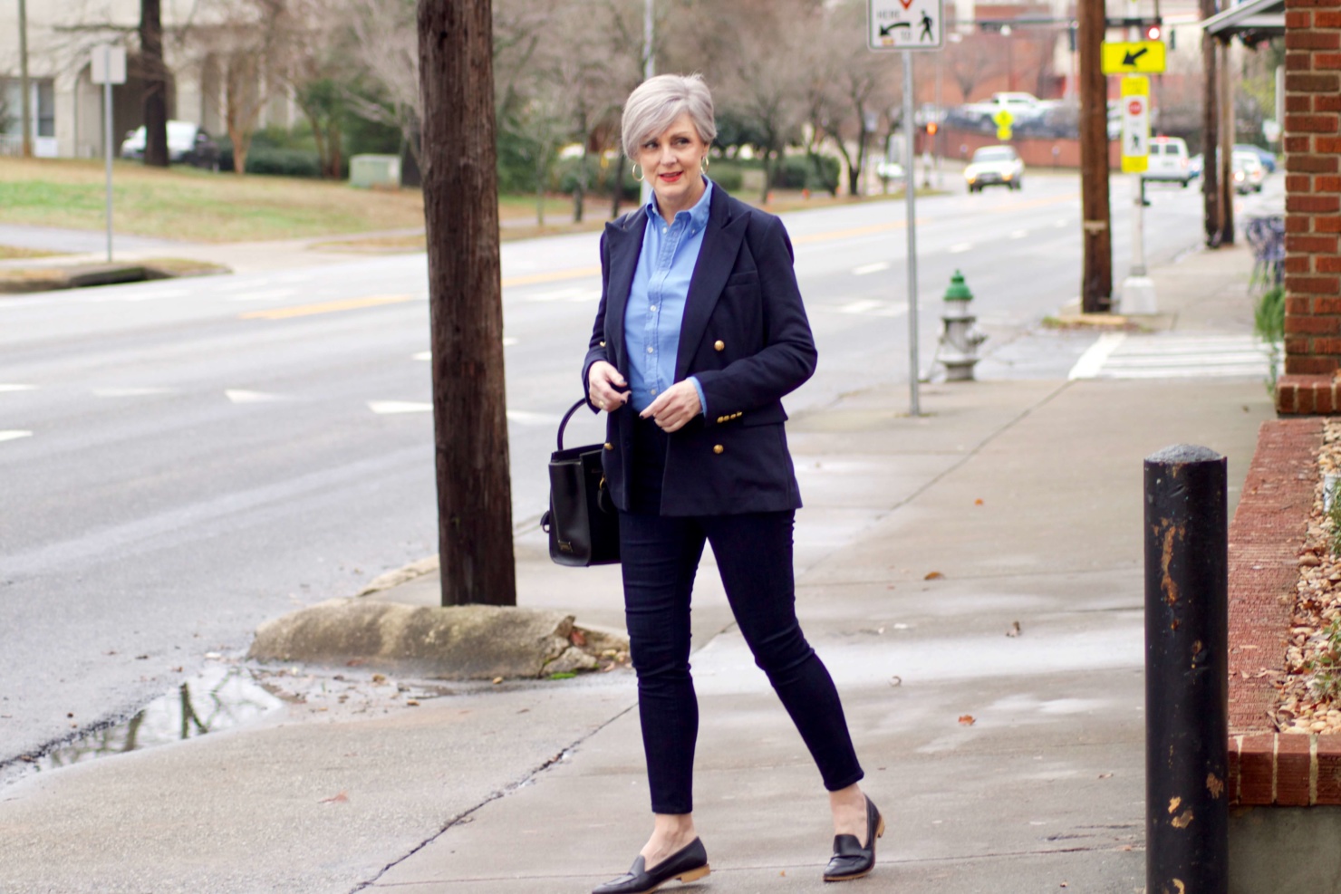 beth from Style at a Certain Age wears a Ralph Lauren navy blue blazer, blue button down, Ann Taylor sailor skinny jeans, and Everlane loafers