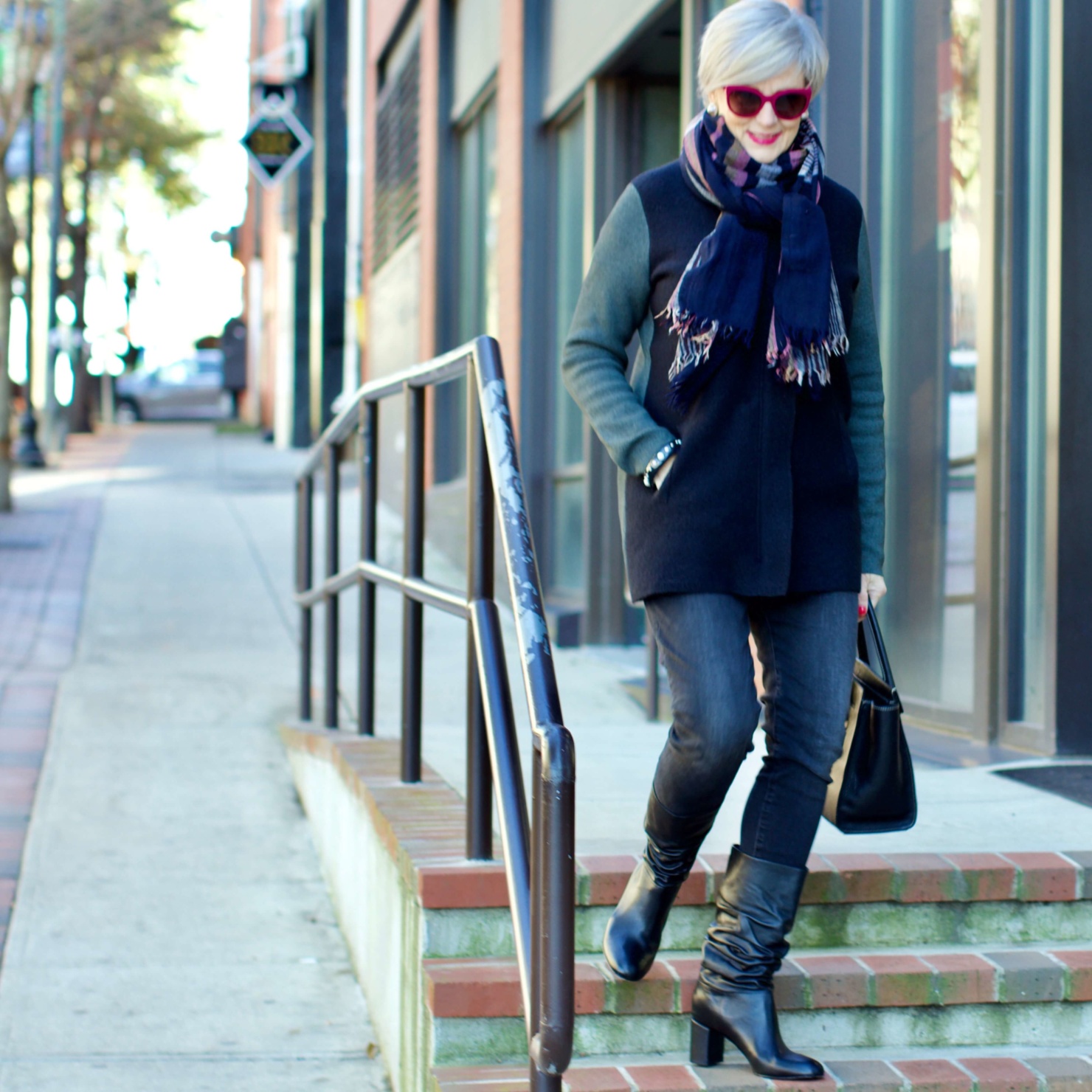 beth from Style at a Certain Age wears an Everlane cashmere waffle square turtleneck, J.Crew Factory black high rise skinny jean, Ann Taylor coatigan, Via Spiga black slouchy boots, Ralph Lauren black handbag, and wool scarf