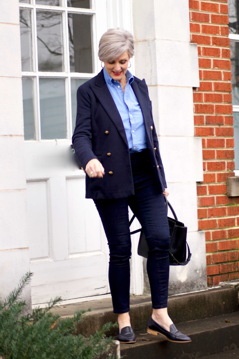 beth from Style at a Certain Age wears a Ralph Lauren navy blue blazer, blue button down, Ann Taylor sailor skinny jeans, and Everlane loafers