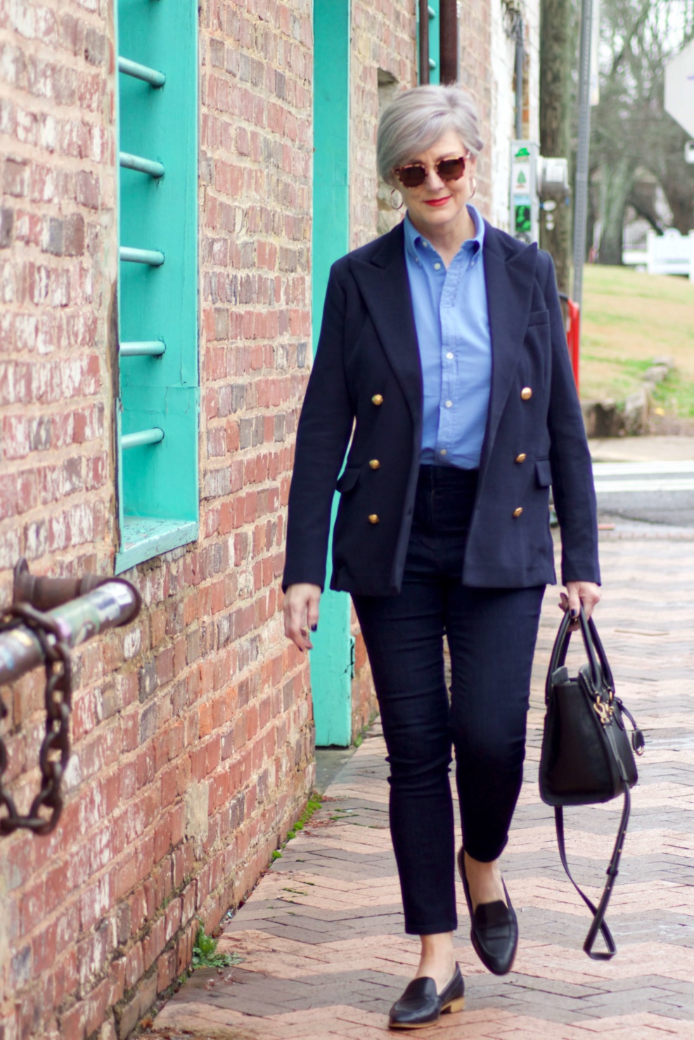 beth from Style at a Certain Age wears a Ralph Lauren navy blue blazer, blue button down, Ann Taylor sailor skinny jeans, and Everlane loafers