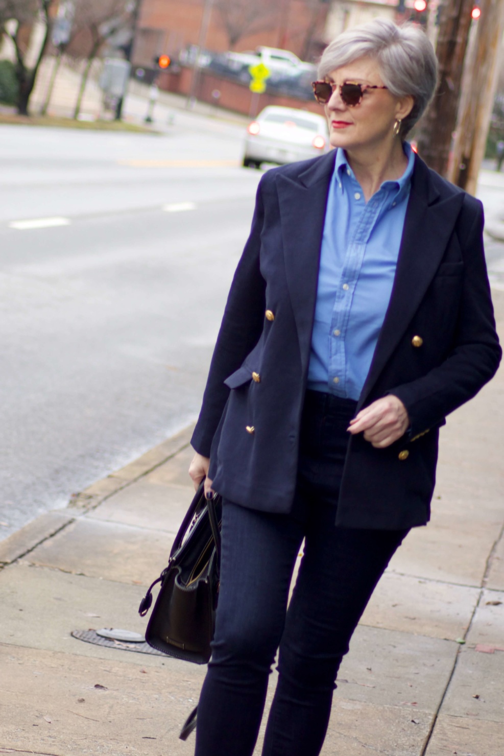 beth from Style at a Certain Age wears a Ralph Lauren navy blue blazer, blue button down, Ann Taylor sailor skinny jeans, and Everlane loafers