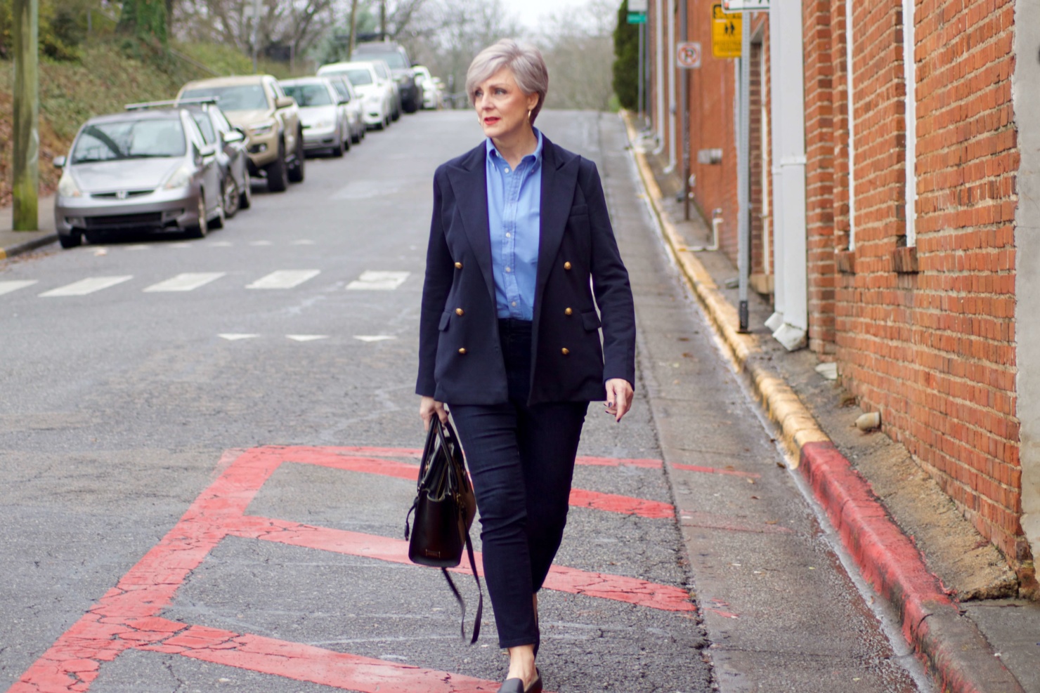 beth from Style at a Certain Age wears a Ralph Lauren navy blue blazer, blue button down, Ann Taylor sailor skinny jeans, and Everlane loafers