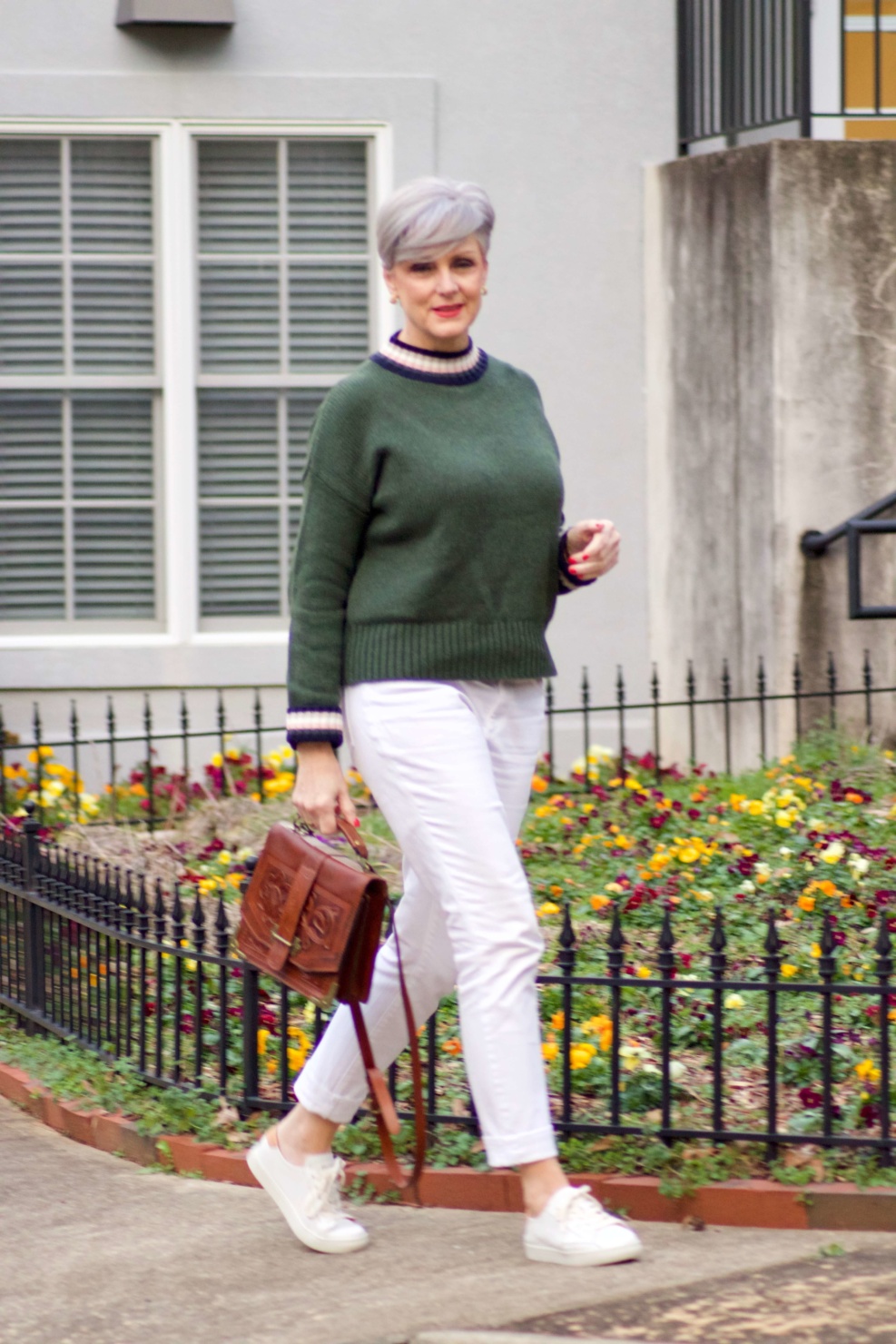 beth from Style at a Certain Age wears a Boden green sweater, white denim and white sneakers