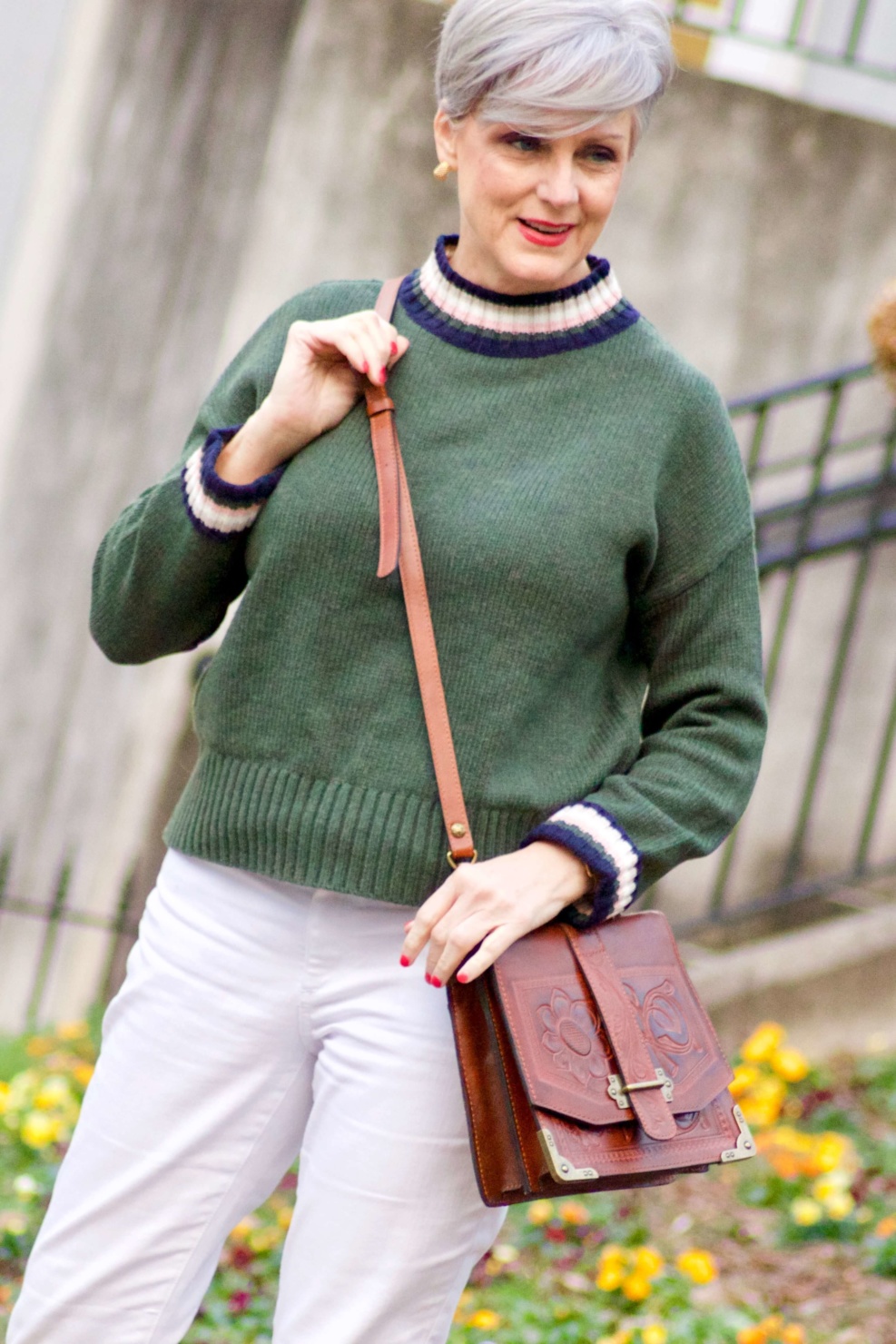 beth from Style at a Certain Age wears a Boden green sweater, white denim and white sneakers