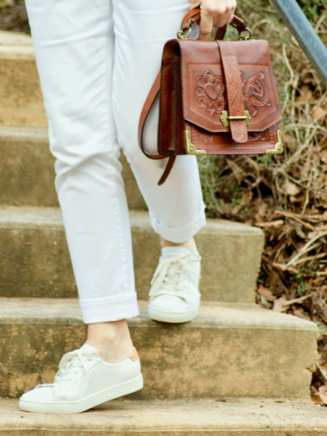 beth from Style at a Certain Age wears a Boden green sweater, white denim and white sneakers