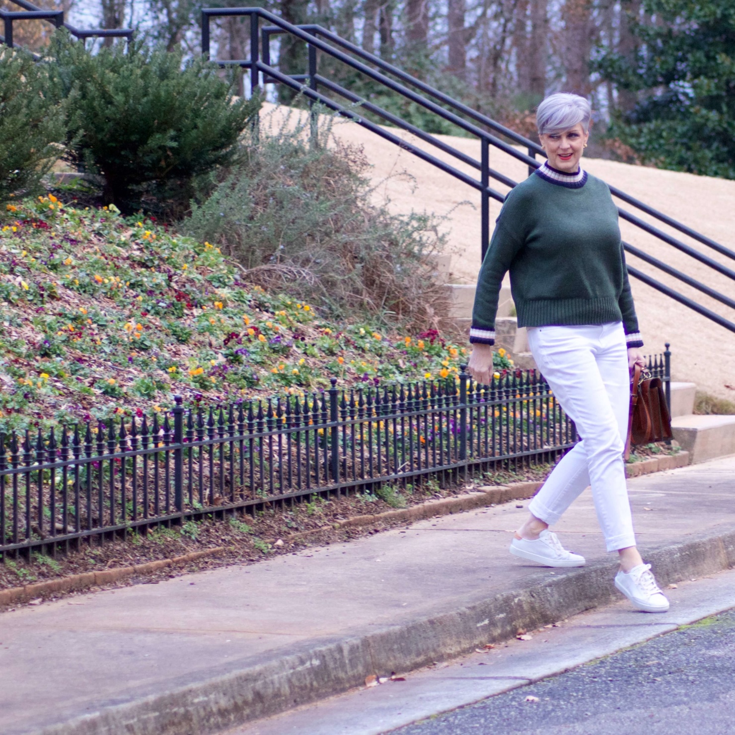 beth from Style at a Certain Age wears a Boden green sweater, white denim and white sneakers