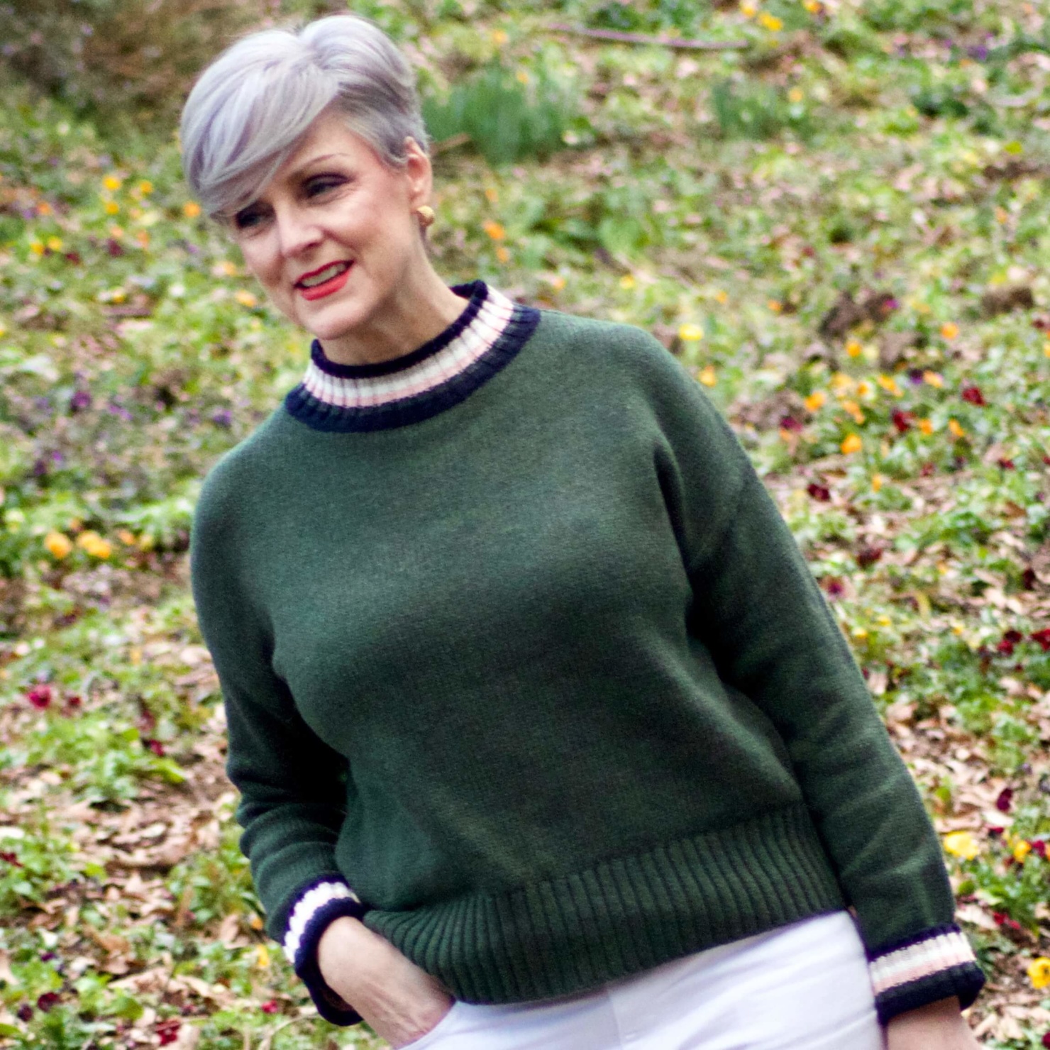 beth from Style at a Certain Age wears a Boden green sweater, white denim and white sneakers