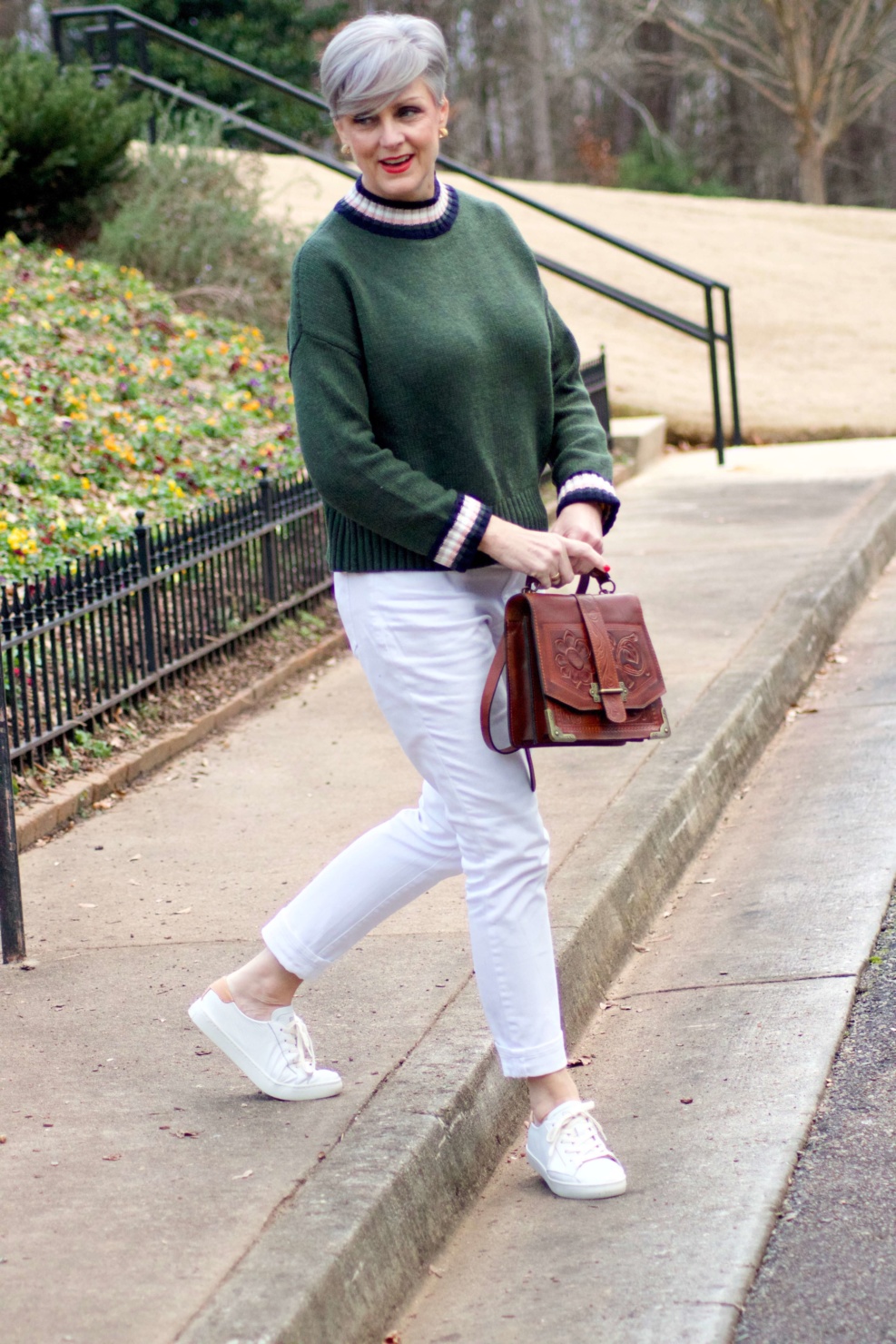 beth from Style at a Certain Age wears a Boden green sweater, white denim and white sneakers