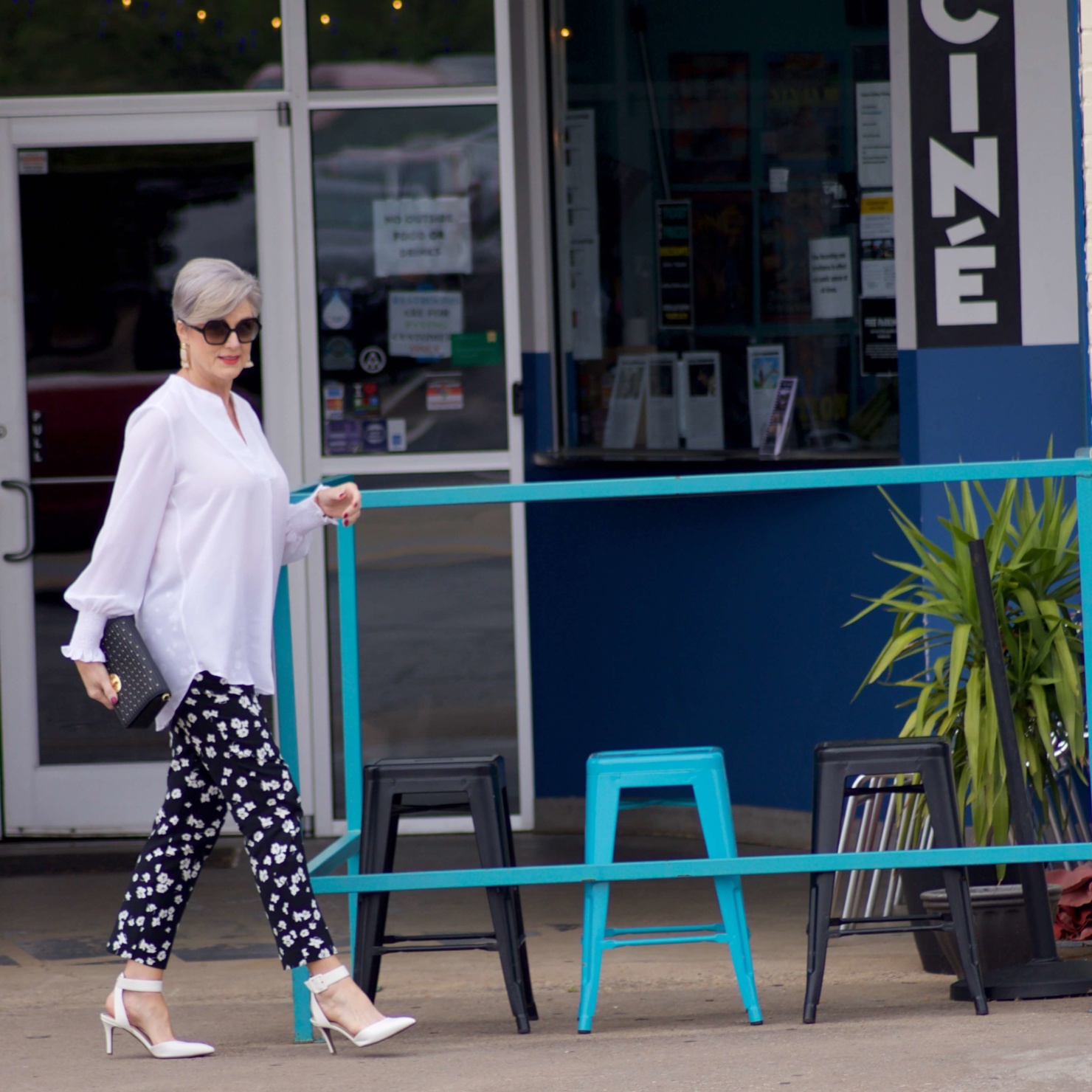 beth from Style at a Certain Age wears an outfit from Lord & Taylor, black pattern pants, white tunic blouse, Sam Edelman shoes