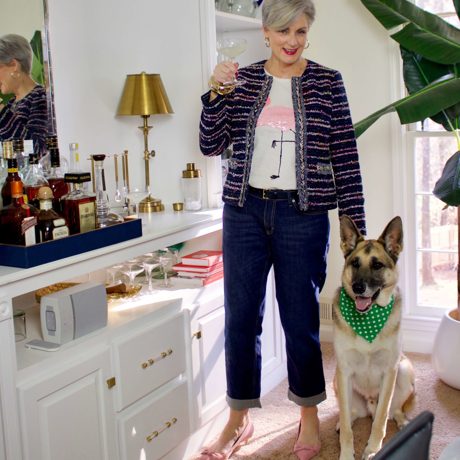 beth from Style at a Certain Age wears boyfriend jeans, graphic tee, tweed blazer and pink kitten heels