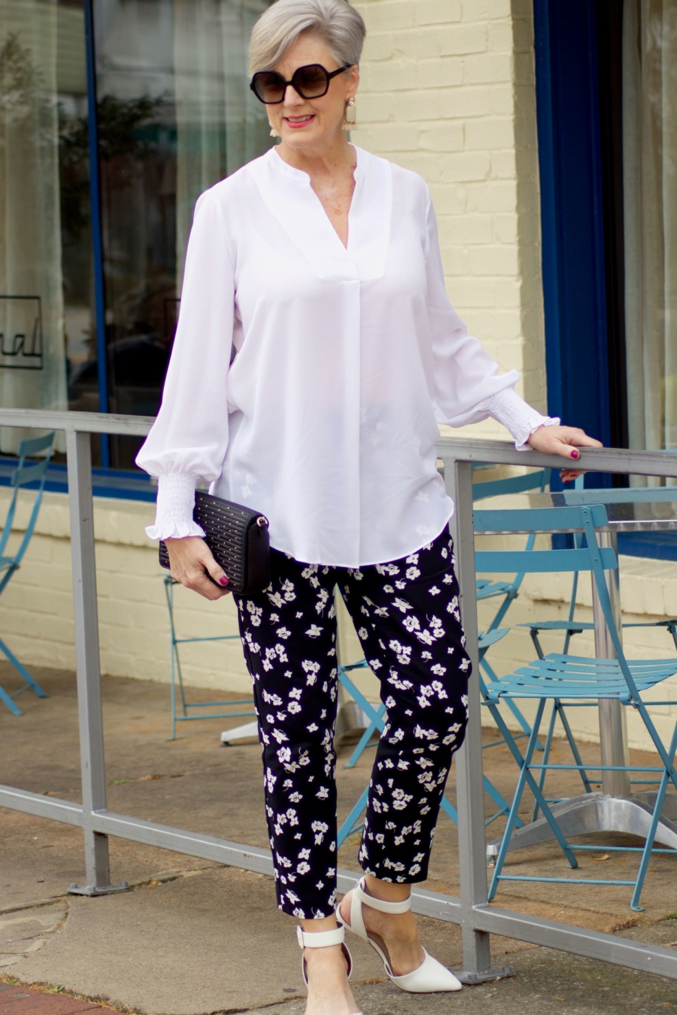 beth from Style at a Certain Age wears an outfit from Lord & Taylor, black pattern pants, white tunic blouse, Sam Edelman shoes