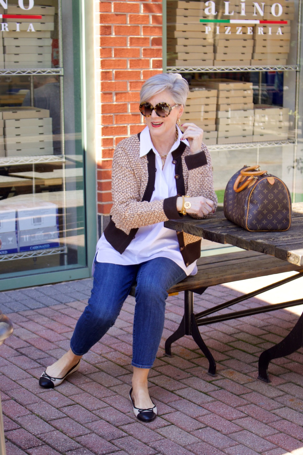 beth from Style at a Certain goes shopping  wearing a Lafayette 148 white shirt, St. John Sport sweater, girlfriend jeans, and ballet flats