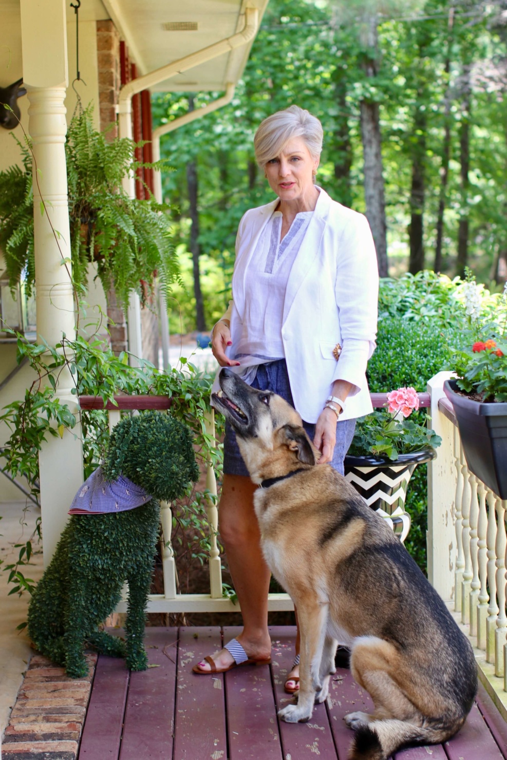 beth from Style at a Certain Age wears a white linen blazer, classic summer blazer, seersucker sandals, and striped linen top