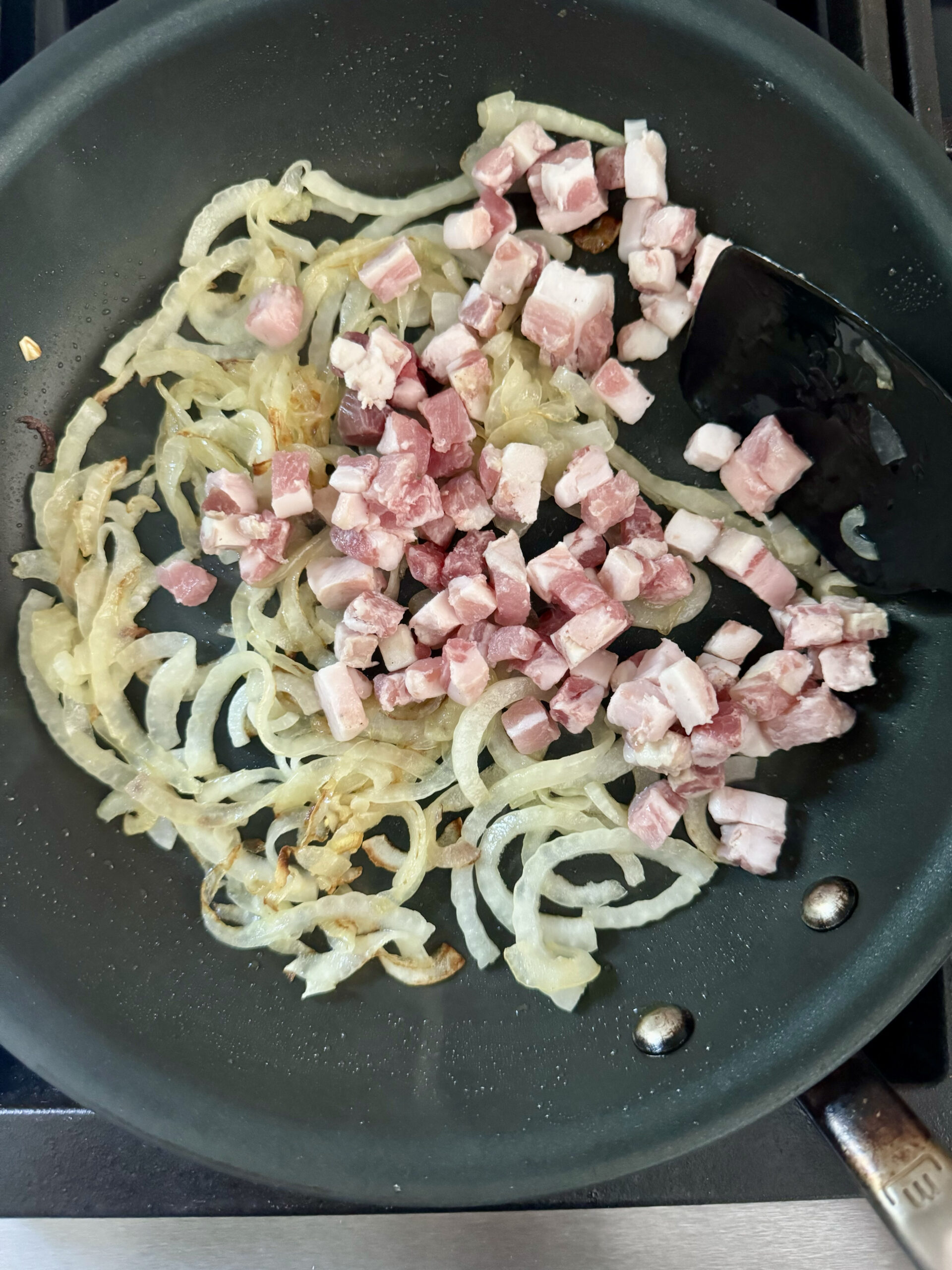 add pancetta cubes and onions