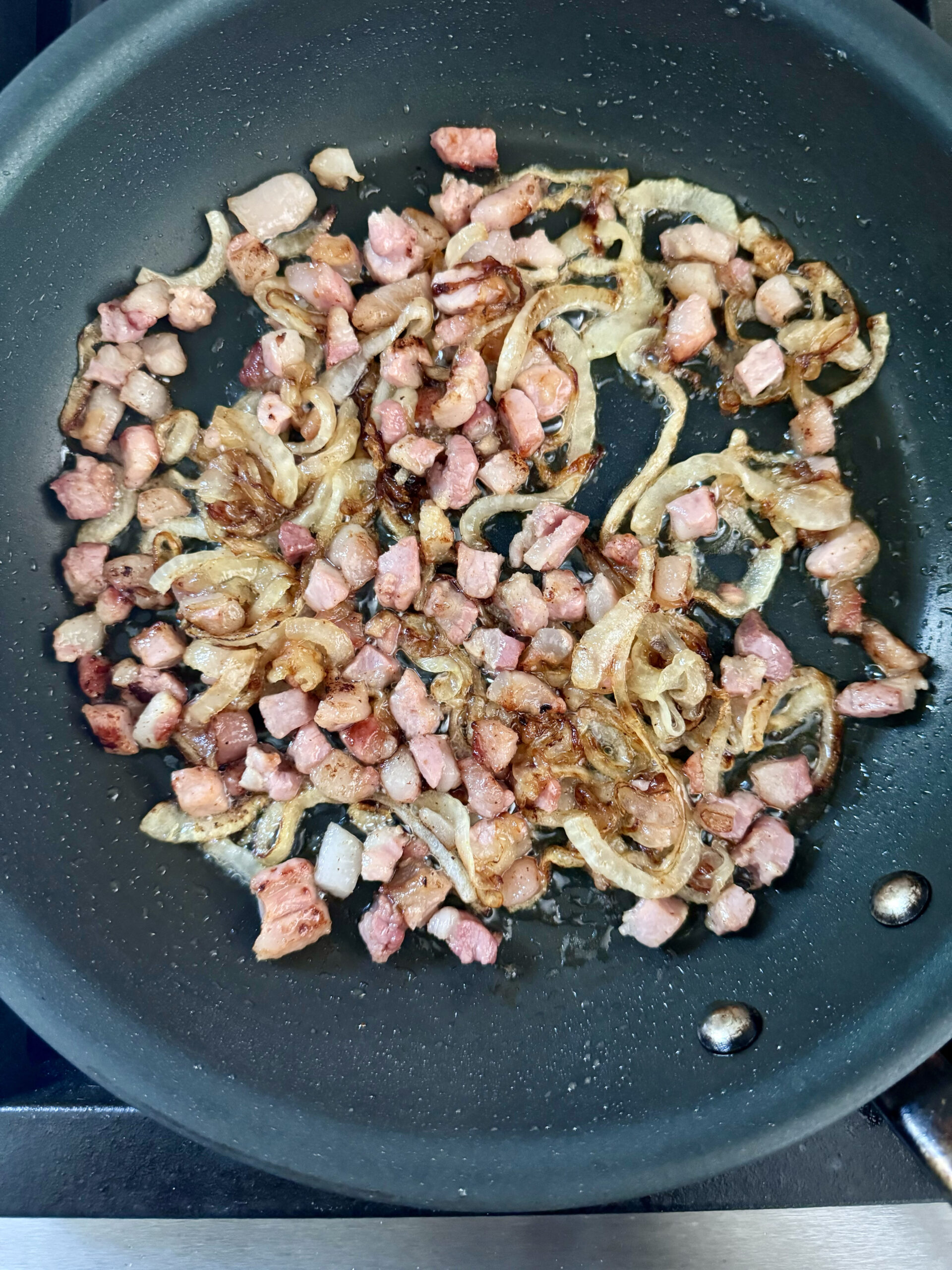 saute pancetta cubes and onions